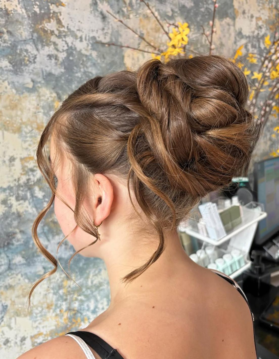 Elegant bridal updo hairstyle with soft curled details